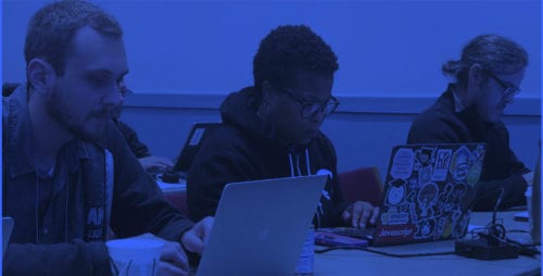 Group of attendees working on their laptops