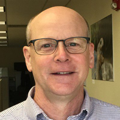 Stephen Battisti smiling for a photo.